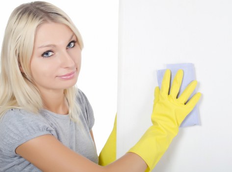Cleaner preparing to clean a bathroom in Outhkensington property